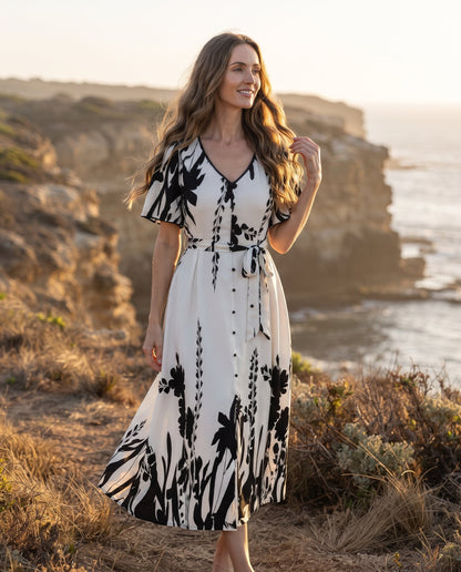 Robe Trapèze à Imprimé Floral – Col V Élégant et Taille Cintrée à Boutons